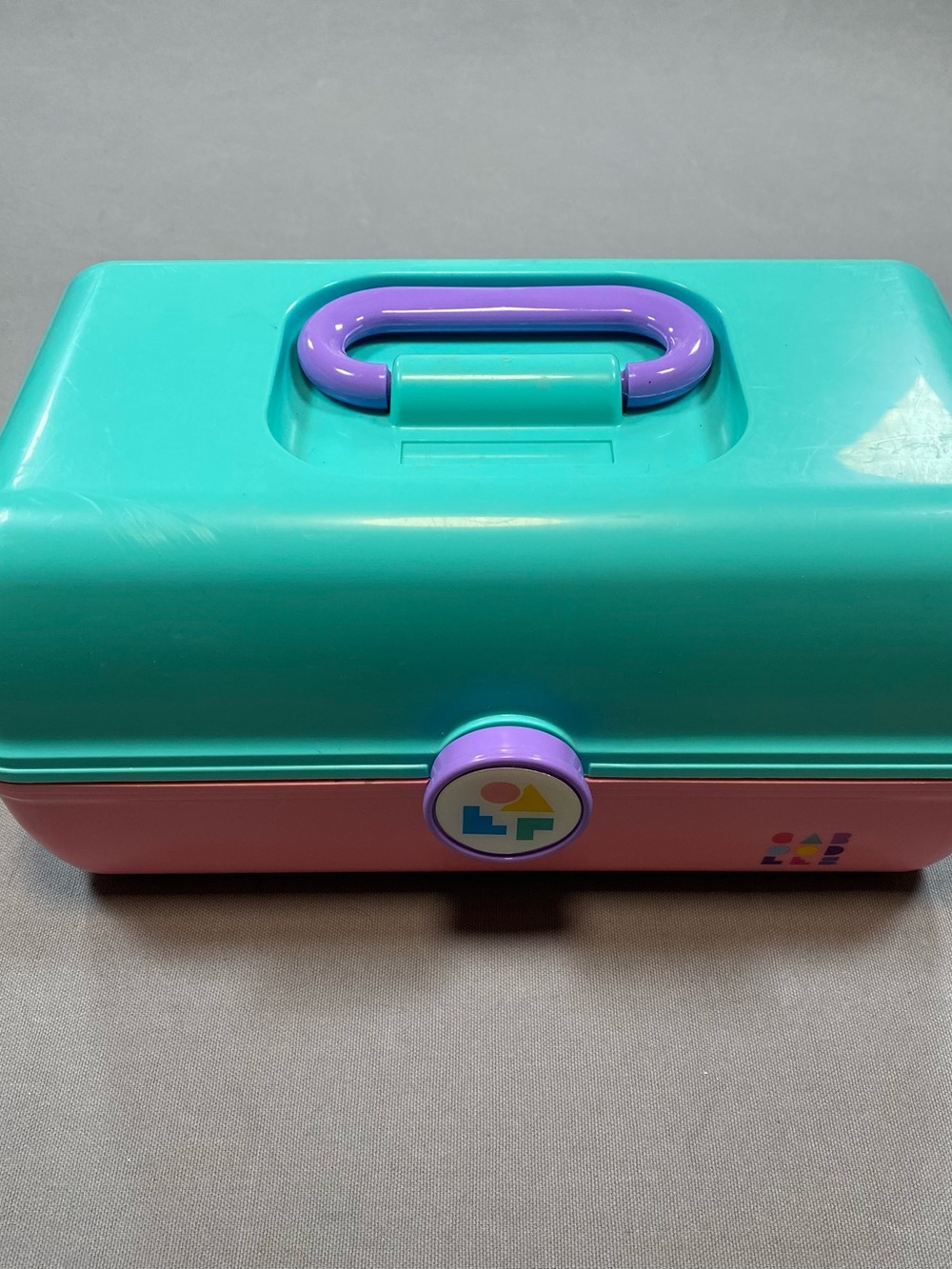 Vintage Caboodles Pink and Teal Makeup Case with Purple handle.